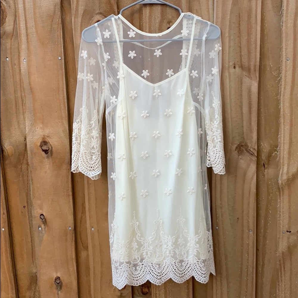 Sheer lace dress with a white slip on underneath